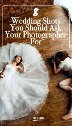 a bride laying on the floor with her wedding dress in front of her and another woman taking a photo