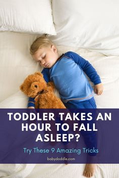 a little boy sleeping on top of a bed next to a teddy bear