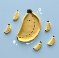 the banana is made out of clay and has holes in it's side to make them look like they are eating bananas