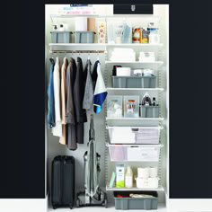 an organized closet with clothes and other items