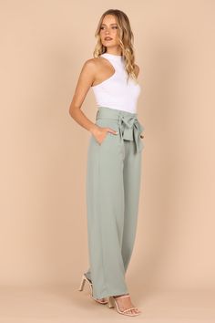 DETAILS
Step into timeless sophistication with our stylish Wide Leg Pant! The high-waisted design and gathered pleated waistband give you a flattering silhouette that's perfect for any occasion.

wide leg style pant
high waisted
gathered pleated waist band
front functional zip with hook and eye clasp
belt loops with detachable waist tie
functional pockets
lined

material - 100% polyester









SIZING

model is 5' 8" and wears a Size 2

model stats: bust -  30.5", waist - 24", hips - 36.5" Satin Dresses Long, Satin Dresses Long Sleeve, Black Tie Wedding Guests, White Dress Shoes, Style Pant, Bachelorette Party Outfit, Resort Dresses, Essential Dress, Crop Top Sweatshirt