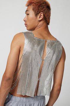 Troye metal tank top in a sleeveless style with an open back and cropped fit. Content + Care Mixed metals Wipe clean Imported Size + Fit S/M Dimensions Chest: 26" + 6" extender Length: 22" L/XL Dimensions Chest: 30.5" + 6" extender Length: 22.5" | Troye Metal Tank Top in Silver, Men's at Urban Outfitters Silver Sleeveless Crop Top For Evening, Silver Sleeveless Crop Top For Night Out, Metallic Sleeveless Crop Top For Evening, Fitted Silver Sleeveless Crop Top, Silver Tank Top For Summer, Urban Outfitters Tank Top For Summer Party, Urban Outfitters Tank Top For Summer Nights Out, Urban Outfitters Tank Top For Night Out In Summer, Urban Outfitters Sleeveless Tank Top For Party