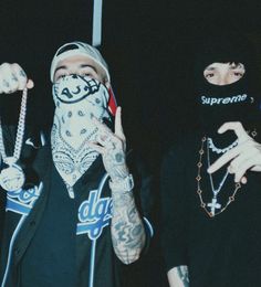 two young men with bandanas on their faces