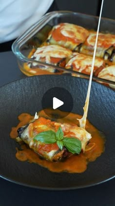 an image of food being served in a pan on a table with utensils