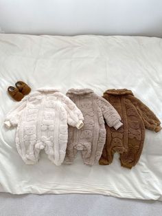 Stay warm and cute this winter with our Winter Infant Baby Thermal Pajamas Romper. Featuring a lovely teddy bear cartoon pattern and a cozy turndown collar, this romper will keep your little one insulated and stylish. Made from high-quality materials, it's perfect for a comfortable night's sleep or a fun day at home. COLOR Khaki, Beige, Brown MATERIAL Polyester SEASON Winter SIZE (AGE) 66 (3-6M), 73 (6-9M), 80 (9-12M), 90 (12-24M) PATTERN Cartoon GENDER Unisex Cozy Winter Onesie For Sleep, Cheap Winter Sleep Onesie, Cozy Super Soft Winter Onesie, Baby Bear Onsie, Teddy Bear Cartoon, Thermal Pajamas, Bear Pajamas Baby, Chubby Babies, Pajama Romper