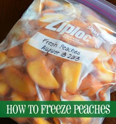 a bag of fresh peaches sitting on top of a wooden table