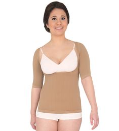 Women's Braless Compression Top For abdomen, sides and back area Wear pulled up to cover the chest area Step into this garment rather than pull it over the head Consider sizing up in this garment Stretch fabric is easier to put on and take off So comfortable you can wear all day 80% Nylon, 20% Spandex, Latex-free Bacteriostatic yarn infused with silver 12/15 mmHg Made in Italy Just as Effective, Not as Tight Active Massage braless top provides high compression results with lower compression comf Fitted Beige Tops With Built-in Bra, Fitted Beige Top With Built-in Bra, Stretch Tops With Medium Bust Support, Compression Top, Compression Wear, Compression Garment, Compression Shirt, Stretch Fabric, Camisole Top