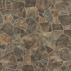 a close up view of a stone wall with brown and tan colored stones on it