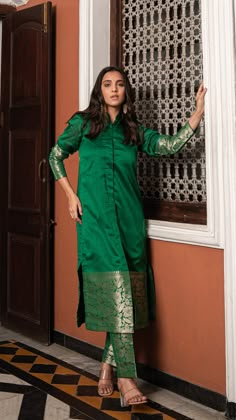 Bring on the festive spirit with our kurta set in pure woven chanderi silk.nWoven Jodhpuri style kurta with matching woven narrow straight pants.nKurta and Pants Fabric : Woven Chanderi Silk.nColour : Dark Green.nModel height is 5.4” and is wearing a size S.nWash Care : Dry Clean Only.nThis product will be exclusively handcrafted for you, making the colour/texture/pattern slightly vary from the image shown, due to multiple artisan-led techniques and processes involved. Stitching Suits Ideas, Saree Making Ideas From Fabric, Chanderi Silk Blouse Designs, Kurta Set From Saree, Silk Saree Kurta Design, Kurta Pant Set Women, Narrow Pants For Kurtis, Indian Kurta Sets For Women, Co Ord Set From Old Saree