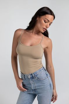 Details Kim is your everyday scoop neck tank top that features a hold-you-in fabric and full length style that sits below the natural waistline. Made in LA Pre-washed Basic Tank Top With Built-in Bra For Everyday, Everyday Camisole Tank Top With Built-in Bra, Everyday Tank Top With Built-in Bra And Scoop Neck, Spring Tank Top With Built-in Bra And Scoop Back, Seamless Scoop Back Tank Top For Spring, Basic Bra Friendly Tank Top Camisole, Bra Friendly Tank Top For Layering, Summer Camisole With Built-in Bra And Scoop Back, Basic Cami Tank Top For Layering