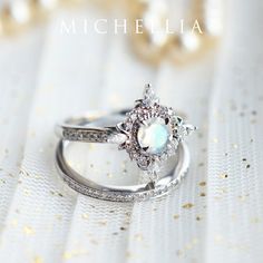 "Our current turnaround time for regular orders is 6-8 weeks. For urgent orders, please shop our Ready-to-Ship collection below (7-10 business days): https://michellia.com/collections/ready-to-ship (please copy and paste into browser) -------- 「Astrid」- Art Deco Petite Ring, in Moonstone | R1007 A daintier sister of our signature \"Alessandra\" ring, \"Astrid\" is designed for those who prefer a more delicate profile without losing the elaborate art-deco inspired details. Despite its size, Astri Heirloom White Moonstone Ring With Rose Cut Diamonds, Celestial Style White Moonstone Ring With Halo, Celestial White Moonstone Ring With Halo, Celestial Moonstone Ring For Wedding, Celestial Moonstone Wedding Ring, Magical Silver Moonstone Wedding Ring, Mystical Round Opal Ring For Anniversary, Heirloom Silver Diamond Moonstone Ring, Mystical Opal Ring For Anniversary