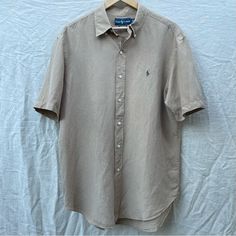 Ralph Lauren Short Sleeve Linen Button Down In Tan (Nwot) Can Also Be Worn By Women As An Oversized Shirt Casual Beige Tops With Snap Buttons, Beige Button-up Business Casual Top, Beige Button-up Top With Placket, Beige Button-up Top For Business Casual, Beige Collared Shirt With Button Closure, Beige Button-down Top For Business Casual, Beige Buttoned Top For Business Casual, Short Sleeve Beige Shirt With Buttons, Beige Short Sleeve Shirt With Buttons