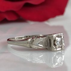 Details: Sweet classic Art Deco diamond ring--this one would make a great engagement ring or just a sweet ring to add to a collection. Would also be a great pinky ring! Please ask all necessary questions prior to placing an order. Measurements: The size is 4 1/2 US, and can be sized for a fee. Condition: The overall all condition of this ring is very good. Diamond Asscher Cut Ring For Anniversary, 14k White Gold Single Diamond Ring For Wedding, Formal Platinum Diamond Ring With Round Band, Elegant Single Diamond Birthstone Ring For Anniversary, Timeless Anniversary Birthstone Ring, Classic Princess Cut Birthstone Ring In 14k Gold, Elegant Formal Birthstone Ring In Diamond White, Promise Diamond Ring With Single Emerald Cut, Promise Diamond Ring With Single Emerald Cut Diamond