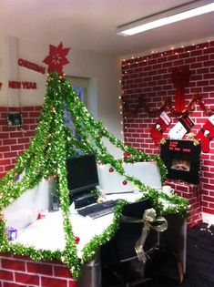 an office cubicle decorated with christmas decorations