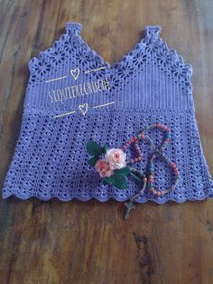 a crocheted doily with flowers and beads on the side that says you're special