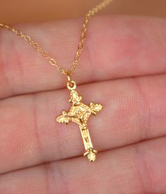 "This is a 14Krose gold filled crucifix cross charm necklace.  This is a beautiful ornate crucifix cross in 18kt rose gold filled, measures 20x12mm and comes on a 14kt rose gold filled shiny cable chain with spring clasp.  Choose length of 16\", 18\", 20\" or 22\".  Comes in a cute gift box ready to present.  STERLING SILVER VERSION NOT SHOWN. *Model is wearing a 16\" length in the photo. GOLD IN PHOTO IS OUT OF STOCK AND WILL NOT BE RETOCKED. ONLY ROSE GOLD AND STERLING SILVER LEFT." Dainty Rose Gold Crucifix Jewelry, Gift Rose Gold Crucifix Cross Necklace, Rose Gold Crucifix Jewelry For Gifts, Catholic Jewelry Necklace, Scapular Necklace, 14kt Gold Jewelry, Jesus Gift, Cross Charm Necklace, Cross Necklace Women