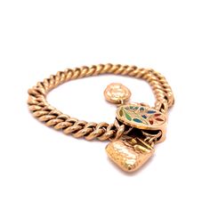 This unique and captivating Victorian-era bracelet is crafted in 14 karat yellow gold. Featuring a charmingly detailed enamel floral charm, this adjustable bracelet is the perfect accessory for any outfit. With an antique and vintage look, this classic Russian-style bracelet brings a timeless elegance to any ensemble. Whether you're searching for a gift for a special someone or just looking to add a little something extra to your own look, this lovely bracelet is sure to bring a touch of vintage Luxury Classic Charm Bracelet With Polished Finish, Luxury Gold Antique-style Charm Bracelet, Luxury Vintage Engraved Charm Bracelet, Vintage Charm Yellow Gold Bracelet, Antique Yellow Gold Bracelets With Vintage Charm, Antique Gold Enamel Bracelets, Antique Enamel Bracelets For Gifts, Antique Enamel Bracelets As Gift, Gold Enamel Bracelet With Charms