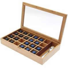 a wooden box filled with lots of blue bottles