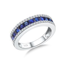 a white gold ring with blue sapphire and diamonds