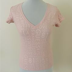 This Guess Women's Basic T-Shirt In Size S Features A V-Neckline And Short Standard Sleeves. Made Of A Cotton And Elastane Jersey Fabric, This Top Is Easy To Care For And Suitable For All Seasons. The Pink Color And Letter Pattern Make It A Great Choice For Casual Occasions. With A Pullover Closure, This Top Is Perfect For Those Who Prefer A Regular Fit. It's A Brand New Item Without Tags And Has Not Been Worn Before. Made In Guatemala, This T-Shirt Is A Must-Have For Women Who Love Comfortable Pink V-neck Graphic Tee Top, Pink V-neck Graphic Tee, Fitted V-neck Tops With Letter Print, Fitted V-neck Top With Letter Print, Shoes List, Guess Clothing, Sublimation Ideas Projects, Sublimation Ideas Projects Inspiration, Personal Things