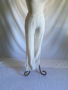 "vintage 1990s side zip pants no tags, look handmade textured light weight cotton feel or rayon maybe size zip w/clasp top fitted through upper w/wide bottom leg and side slits w/mesh detail embroidery scalloped hem good vintage condition, light wear measures, lying flat, waist-13 1/2\" rise-9 1/2\" inseam-30 1/2\" hem-8 3/4\" outseam-40 1/2\" hip-19 1/2\"" Vintage Wide Leg Stretch Pants, Vintage Stretch Wide Leg Pants, Vintage Non-stretch Wide Leg Pants, Vintage Stretch Cotton Bottoms, Fitted Wide Leg Linen Pants, Fitted Wide Leg Harem Pants For Spring, Bohemian Fitted Pants For Loungewear, Bohemian Fitted Straight Pants, Vintage Fitted Cotton Wide Leg Pants