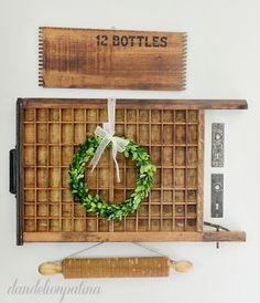 an overhead view of a kitchen with a wreath on the wall and other items around it