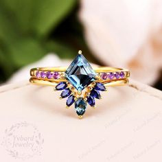 Please confirm your US size when you make an order)========================================================================================Jewelry Details-Gold Type : 14k goldEngagement RingCenter Stone: NATURAL London Blue Topaz, Approximately 2.0ctStone Size: 7*8mmCut: Kite Cut (Long Rhombus)Side Stones: NATURAL AmethystTotal weight: 0.12 ctwWedding BandCenter Stone: NATURAL London Blue TopazCarat Weight: approx. 0.12ctSide Stones: NATURAL SapphireCarat Weight: approx. 0.24ctwEngagement Band W London Blue Topaz Engagement Ring, London Blue Topaz Engagement Rings, Amethyst Wedding, Unique Engagement Ring Settings, Blue Topaz Engagement Ring, 14k Gold Engagement Ring, Gemstone Art, Topaz Engagement Ring, Jewelry Details