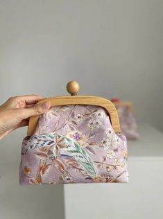 Shoulder Wooden Frame Handbag - Gifts idea for her, Bag for Mother, Bag for sister, Christmas gift idea, Clutch handbag, little handbag A stunning handbag adorned with delicate watercolor flowers, light and airy. It's like carrying a whole summer of blooms with you. Material - fabric. Wooden lock Size - 9x6.7x3.14inch (23x17x8cm) The strap is pink and made from a leather substitute. The length is adjustable, with a maximum length of 45inch (115cm) Let me know if any questions or you need more photos. Wooden Lock, Sister Christmas Gift, Delicate Watercolor, Sister Christmas, Wedding Bag, Botanical Pattern, Christmas Gift Idea, Pink Watercolor, Pattern Fabric