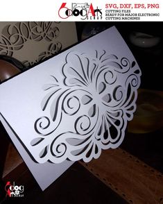 a white card with an intricate design on it