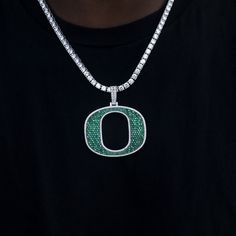 GLD has teamed up with the National Collegiate Athletic Association to introduce the official NCAA Team Pendants. This Large 14k White Gold piece was meticulously crafted with green hand-set stones to accurately depict the Oregon Ducks "O" Team Logo. Rep your squad with this official pendant to 'Win The Day!' . This product is guaranteed for life - GLD will repair the item should you experience any defects in craftsmanship or breakage. Pendant Specifications - 58mm x 48mm (Width x Height) - Weig Oregon Ducks Logo, Green Hand, Oregon Ducks, Gold Piece, Vermeil Jewelry, Custom Earrings, Drop Necklace, Pendant Bracelet, Chain Pendants