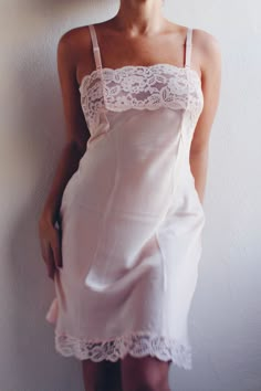 This exquisite nightgown features a sheer lace bust that adds a touch of romance and sophistication, making it an ideal choice for warm, light summer nights. Crafted from high-quality vintage fabric, this pink lace slip is designed to provide both comfort and style. The pale pink hue exudes a soft, feminine allure, while the sheer lace detailing on the bust creates a captivating and delicate look. Whether you're lounging at home or looking for a charming addition to your vintage lingerie collect Coquette Summer, Pink Nightgown, Delicate Lingerie, Chemise Dress, Vintage Slip Dress, Vintage Slip, Cute Coquette, Lingerie Vintage, Rose Pale