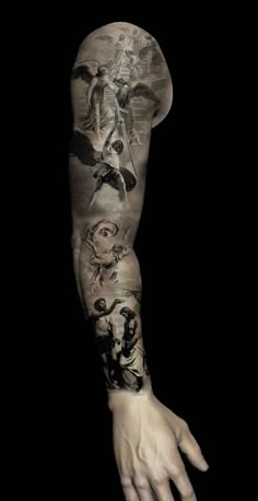 a man's arm with tattoos on it