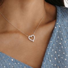 The Classic Diamond Heart Necklace showcasing an open diamond design combines romance and tradition. This necklace is the perfect way to express your heartfelt affections. Round Diamonds 0.70cttw 14K White Gold Length: 16 inch curb link chain