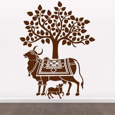 a wall decal with an animal and tree in the middle, on a wooden floor