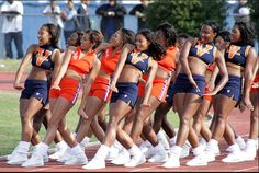 the cheerleaders are lined up on the field