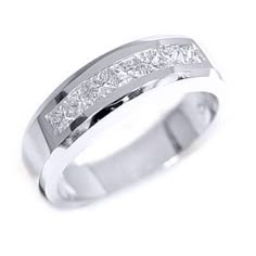 a white gold wedding ring with princess cut diamonds on the side and channeled sides