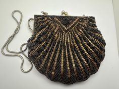 Beautiful Vintage Gold and Black Beaded Purse/Clutch/Handbag/Evening Bag Condition consistent with age and use. Please see photos for details. Antique Beaded Evening Bag, Antique Style Evening Clutch Bag, Accessory Design, Beaded Purses, Purse Clutch, Clutch Handbag, Black Beads, Evening Clutch Bag, Vintage Gold