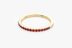 "14k Solid Gold Ruby Ring / Half Eternity Ruby Ring Micro Pave Set / Stackable Natural Genuine Ruby Ring / July Birthstone Ring Ferko's Fine Jewelry Features * Made to Order * Gold Kt: 14K (also available in 18K) * Available Gold Color: Rose Gold, Yellow Gold, White Gold * Width of Ring - 1.65MM * Round Ruby: 19 pc 1.45MM * Ruby CTW: 0.30 ctw * Ready to Ship in 7-10 Business Days If you have any additional questions about this product, just hit the \"Message Ferko\" button and we will get back t Elegant Ruby Gemstone Eternity Band, Elegant Ruby Eternity Band, Yellow Gold Halo Ruby Ring For Wedding, Stackable Ruby Eternity Band In Yellow Gold, Ruby Eternity Band In Yellow Gold Stackable, Yellow Gold Ruby Eternity Band Stackable, Yellow Gold Gemstone Eternity Band For Anniversary, Elegant Ruby Eternity Band In Yellow Gold, Yellow Gold Ruby Round Cut Eternity Band