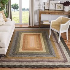 a living room filled with furniture and a rug