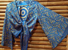 Handmade silk top, wide Japanese bell sleeves, one size fits all. India. 100% silk. Blue Silk Blouse With Blouson Sleeves, Bohemian Blue Silk Tops, Festive Top With Blouson Long Sleeves, Festive Tops With Blouson Long Sleeves, Festive Long Sleeve Top With Blouson Sleeves, Blue Silk Long Sleeve Blouse, Silk Long Sleeve Unstitched Blouse, Bohemian Silk Unstitched Blouse Piece, Bohemian Unstitched Silk Blouse Piece