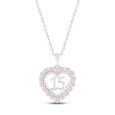 A stunning surprise for the birthday girl, this 10K white gold Quinceañera necklace features a heart with the number 15 at the center. Shimmering lab-created opals trace the heart, making the necklace an ideal gift for an October birthday. The pendant sways from an 18-inch cable chain that secures with a spring-ring clasp. White Gold Heart-shaped Birthstone Necklace For Anniversary, White Gold Jewelry For Birthday And Valentine's Day, Pink Hallmarked Jewelry For Anniversary, White Gold Birthstone Necklace For Valentine's Anniversary, White Gold Birthstone Necklace For Anniversary On Valentine's Day, White Heart Necklace For Birthday And Valentine's Day, White Necklace With Heart Charm For Birthday, Round Birthstone Necklace For Valentine's Day Anniversary, Silver Heart Necklace With Hallmark For Birthday