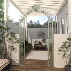 an outdoor patio with wooden floors and plants on the floor, surrounded by white walls