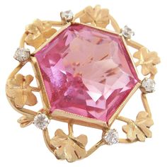 Retro 14K yellow gold custom made brooch - set with one hexagonal cut pink crystal (approx. 24 carats - 20 mm. x 17 mm. x 13 mm. deep) - surrounded by gold chased sprigs of clover and six claw set clear crystals (approx. 1/3 carat total - 2 mm. diameter each) - beautifully finished back with twisted rope detail - original pin with custom spring hinge and 'c' catch - signed 'A.M.' (unidentified maker) - acid tested for gold purity - Italy (likely) - circa 1960's. Excellent vintage condition - cou Pink Sapphire Brooch, Antique Pink Brooch Jewelry, Crystal Brooch Pink, Vintage Pink Collectible Brooches, Vintage Gold Multi-stone Brooches, Crystal Brooch, 3 Carat, Pink Crystal, Aging Signs