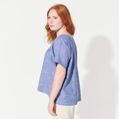 This airy, oversized blouse features two triangle cut-outs at the chest. Made with a lovely light chambray with a bit of stretch (cotton with lycra). Blouse is 23.5" long in front and 27" long in back. Fit is loose. Machine wash and dry.Need a custom length? Just ask!This tee is MADE TO ORDER and ships within TWO WEEKS. SIZE CHART Relaxed Fit Cotton Blouse For Everyday, Cotton Blouse With Relaxed Fit For Everyday, Everyday Relaxed Fit Cotton Blouse, Relaxed Cotton Tops For Spring, Casual Cotton Blouse For Daywear, Relaxed Fit Cotton Tops For Daywear, Effortless Cotton Blouse For Daywear, Relaxed Cotton Everyday Blouse, Relaxed Cotton Blouse For Everyday