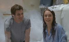 a man and woman are in the foam room