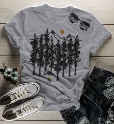 Women's Camping T Shirt Hipster Shirts Forest Nature Shirt Woods TShirt Camping Tee Hipster TShirt For me, there is something so peaceful about camping, especially some place remote where you're truly alone to reflect. This hipster tshirt features a forest scene with a lone tent and campfire. Perfect for your next adventure. If you're going out into the wild for some time to reflect on your own, these hipster shirts are perfect for you! Made of soft ring spun cotton and includes a cotton muslin Casual Gray T-shirt For Outdoor, Gray Summer Outdoor Top, Summer Camping T-shirt With Crew Neck, Summer Outdoor Cotton T-shirt, Cotton Graphic Print Tops For Outdoor Activities, Gray Short Sleeve Top For Outdoor, Summer Graphic Print Tops For Outdoor, Casual Graphic Print Tops For Outdoor Activities, Gray Crew Neck Top For Outdoor Activities