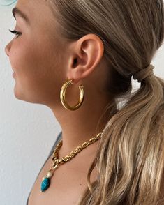 Get your hoop game on point with our Eilish Everyday Gold Hoops. These basic hoop earrings are perfect for everyday wear, adding a touch of understated elegance to any outfit. Size: SM 1" LG 1.5" Waterproof Tarnish resistant 18K Gold plated stainless steel Hypoallergenic Small Hoop Jewelry For Everyday Use, Trendy Tarnish Resistant Hoop Earrings For Everyday, Hoop Games, Congo Kinshasa, Understated Elegance, Game On, Gold Hoops, Papua New Guinea, Equatorial Guinea