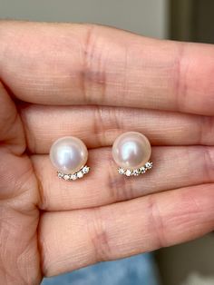 Discover the enchanting beauty of these top-grade freshwater pearl earrings, boasting a perfectly round shape that exemplifies their flawless craftsmanship. These white pearls, with a subtle yet captivating pink overtone, measure approximately 9-9.5mm in diameter, offering a symphony of elegance and grace. Each pearl is set in high-quality S925 sterling silver, known for its durability and purity, and is delicately plated with 18K gold, enhancing its allure with a touch of opulence. The combination of the pearls' spherical perfection and the luxurious gold plating makes these earrings a quintessential accessory for those who seek sophistication and timeless charm in their jewelry collection. Pear-shaped Pearl Charm Earrings For Anniversary, Classic Round Pearl Drop Earrings, Classic Round Pearl Earrings, Classic Round Earrings With Pearl Buttons, Classic Round Pearl Button Earrings, Classic Pearl Earrings With Pendant For Anniversary, Luxury Round Pearl Drop Earrings, Classic Pearl Pendant Earrings For Anniversary, Classic High Luster Pearl Earrings For Anniversary