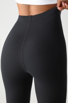 The Body Legging - Sueded Onyx – JOAH BROWN® Fitted Athleisure Tights With Contoured Waistband, Fitted Tights With Contoured Waistband For Athleisure, Fitted Seamless Yoga Pants In Elastane, Sleek High Waist Fitted Leggings, Sculpting Elastane Yoga Pants For Workout, High Waist Sculpting Sporty Leggings, Compressive High-cut Athleisure Leggings, Sporty High Waist Sculpting Leggings, Seamless Elastane Leggings