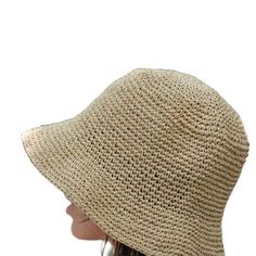 This hat is 100% handmade and crafted from raffia yarn. Raffia yarn is a natural and durable material, ensuring the hat's longevity. The wide brim of the hat is perfect for sun protection and offers a stylish look. This beige hat stands out with its simple and elegant design. It is an excellent accessory for both everyday use and outdoor activities like the beach. Its comfortable and lightweight structure ensures easy and prolonged wear. Raffia. You can store this hat, knitted from raffia rope, in a breathable cloth bag, protect it from fire and heat, and wipe the stains with a clean damp cloth. Woven Toquilla Straw Bucket Hat With Curved Brim, Natural Woven Bucket Hat With Short Brim, Natural Handwoven Bucket Hat With Curved Brim, Open Weave Flat Brim Straw Sun Hat, Open Weave Straw Sun Hat With Flat Brim, Straw Open Weave Sun Hat With Flat Brim, Natural Toquilla Straw Bucket Hat With Flat Brim, Straw Sun Hat With Open Weave Flat Brim, Natural Woven Wide Brim Bucket Hat